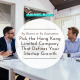 Youthful team with laptops & coffee brainstorming in a modern office in which Hong Kong limited company drives startup growth.